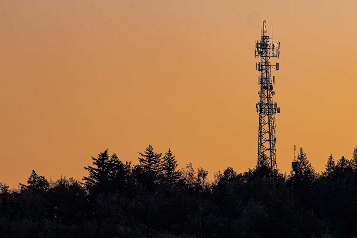 Cellular tower in front of an evening sky