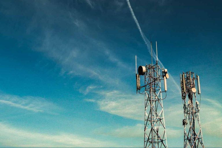 Cellular towers with blue sky behind
